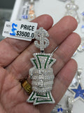 Hand gripping money pendant